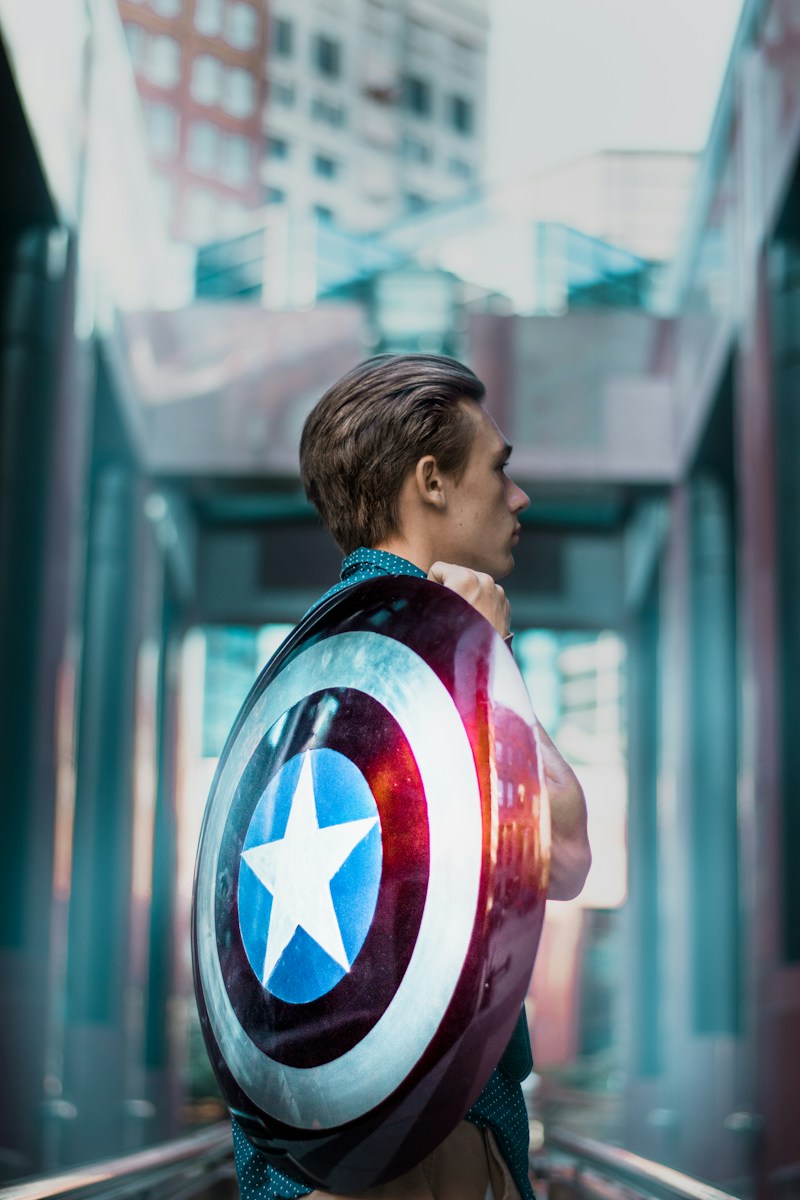 man carrying Captain America's shield helping to make sure all your assets are protected